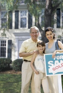 Family Outside Their New House